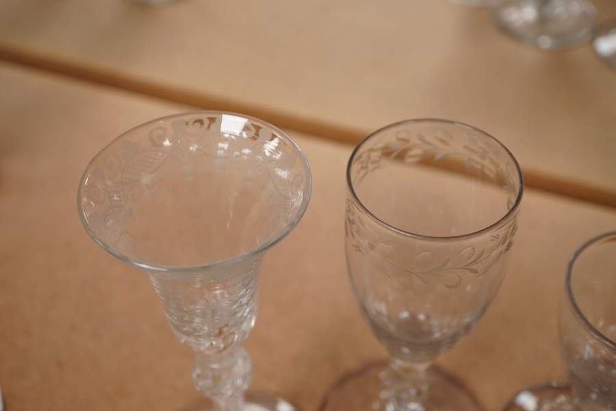 Four Georgian wine glasses, three with engraved bowls, three with faceted stems, and one with an air twist knopped stem and stepped foot, tallest 16cm